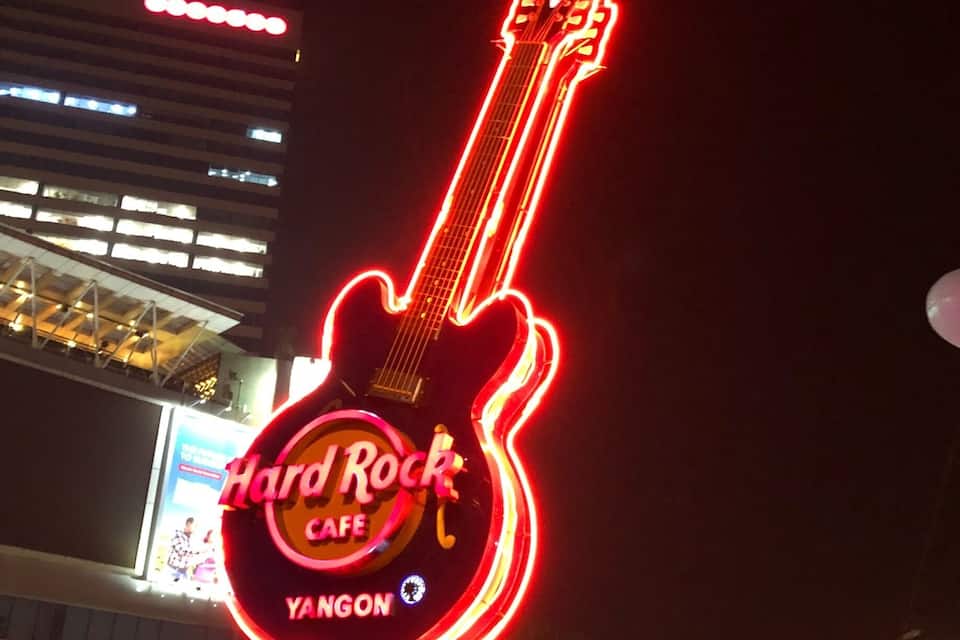 A neon guitar sign for Hard Rock Cafe in Yogyakarta.
