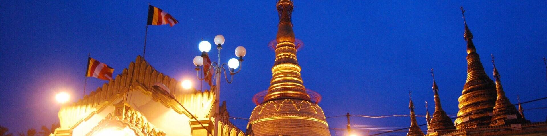 Botahtaung Pagoda as the sun went down. I am not sure what the entrance fee for foreigners is but the huge sign is slightly obnoxious, isn't it?! The Pagoda is very close to some piers which are quite fun to explore. After seeing many other pagodas in the city, we opted out of paying to see another one.