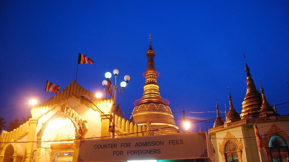 Botahtaung Pagoda as the sun went down. I am not sure what the entrance fee for foreigners is but the huge sign is slightly obnoxious, isn't it?! The Pagoda is very close to some piers which are quite fun to explore. After seeing many other pagodas in the city, we opted out of paying to see another one.