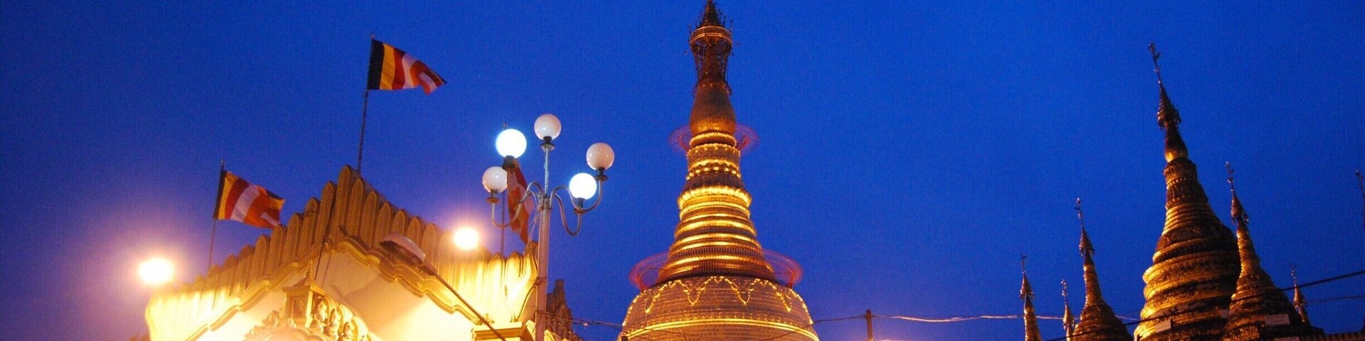 Botahtaung Pagoda as the sun went down. I am not sure what the entrance fee for foreigners is but the huge sign is slightly obnoxious, isn't it?! The Pagoda is very close to some piers which are quite fun to explore. After seeing many other pagodas in the city, we opted out of paying to see another one.