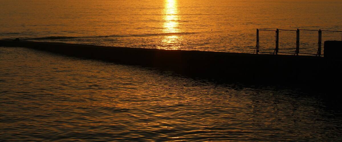 I took this on July 2nd in Sochi, Russia. More specifically in the Adler area. I definitely had a really relaxing trip there! I was mostly at the Black Sea beaches, but I did spend a day in the Caucasus Mountains! But the sunset moments were perhaps my favorite. They always looked so serene at the beach :). And a very peaceful time! Quite a contrast, too, from the crowded beach days. Even in the morning it was already crowded. People wanted to go before the high temperatures came. But at evening it cooled down, but also most of the people left :). Here is one of those shots!