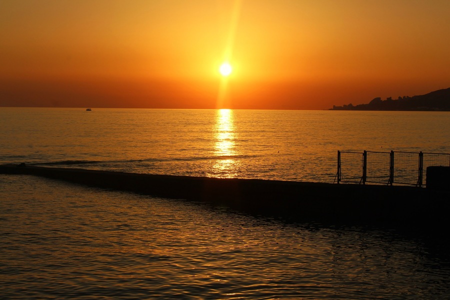 I took this on July 2nd in Sochi, Russia. More specifically in the Adler area. I definitely had a really relaxing trip there! I was mostly at the Black Sea beaches, but I did spend a day in the Caucasus Mountains! But the sunset moments were perhaps my favorite. They always looked so serene at the beach :). And a very peaceful time! Quite a contrast, too, from the crowded beach days. Even in the morning it was already crowded. People wanted to go before the high temperatures came. But at evening it cooled down, but also most of the people left :). Here is one of those shots!