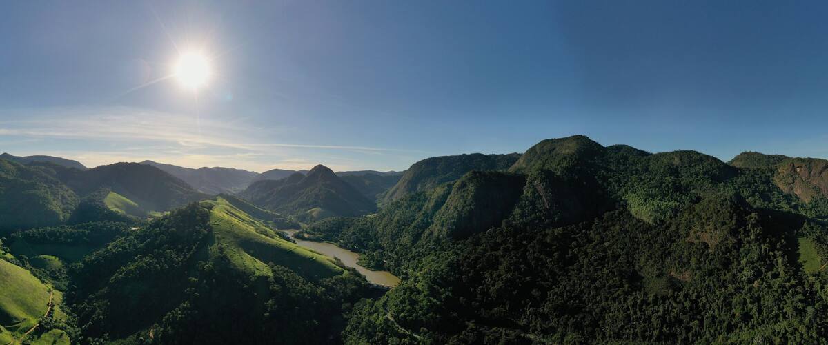 A mountainous landscape with a river winding through it.