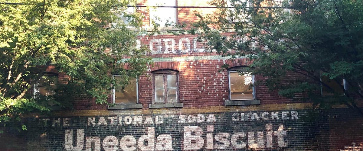 Advertising from days gone by on the side of a building across from St Johns Church.