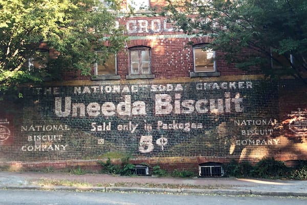 Advertising from days gone by on the side of a building across from St Johns Church.