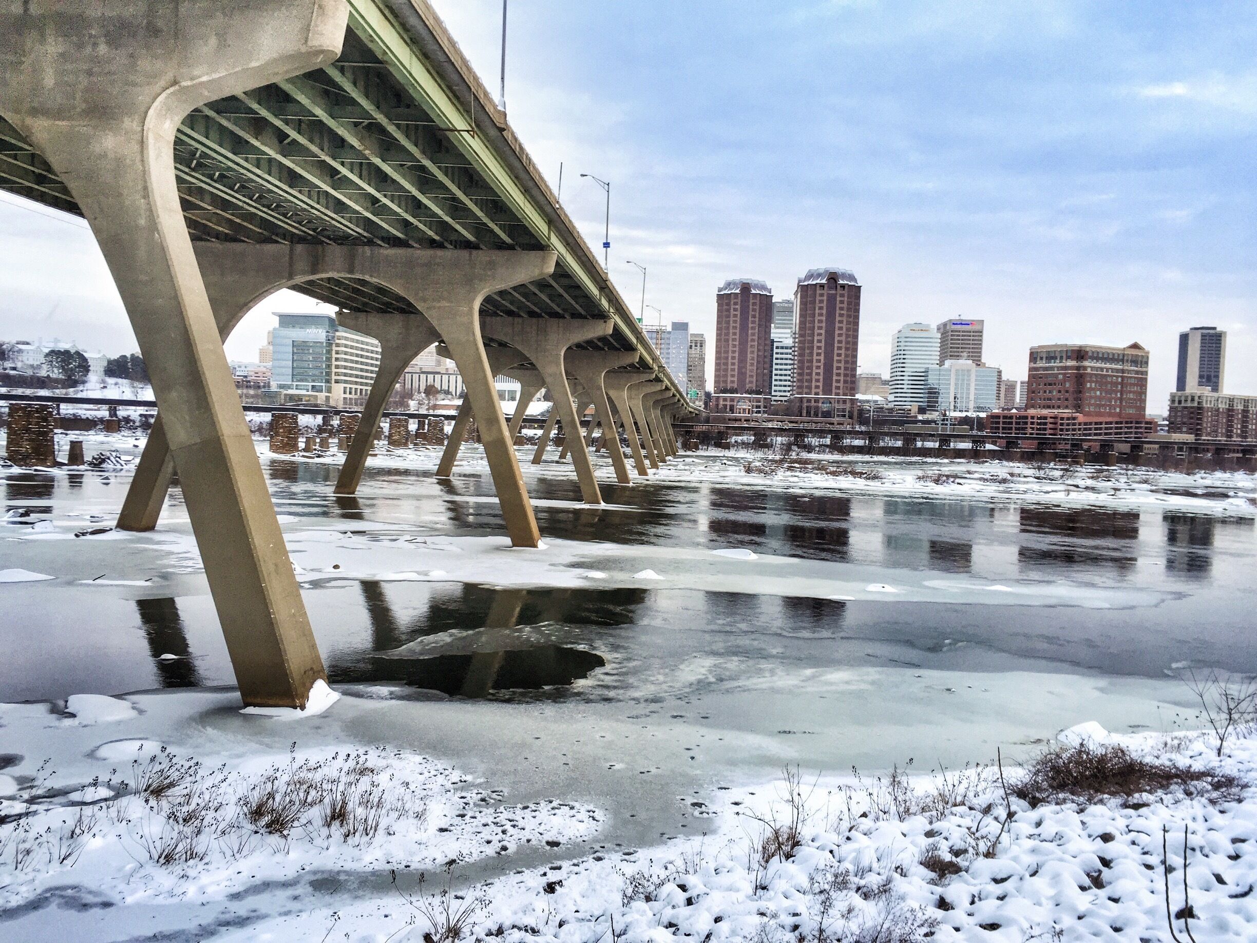 Richmond, VA skyline, with a #snow and ice covering. Get to this spot by walking along the Flood Wall Walk in Manchester. 
