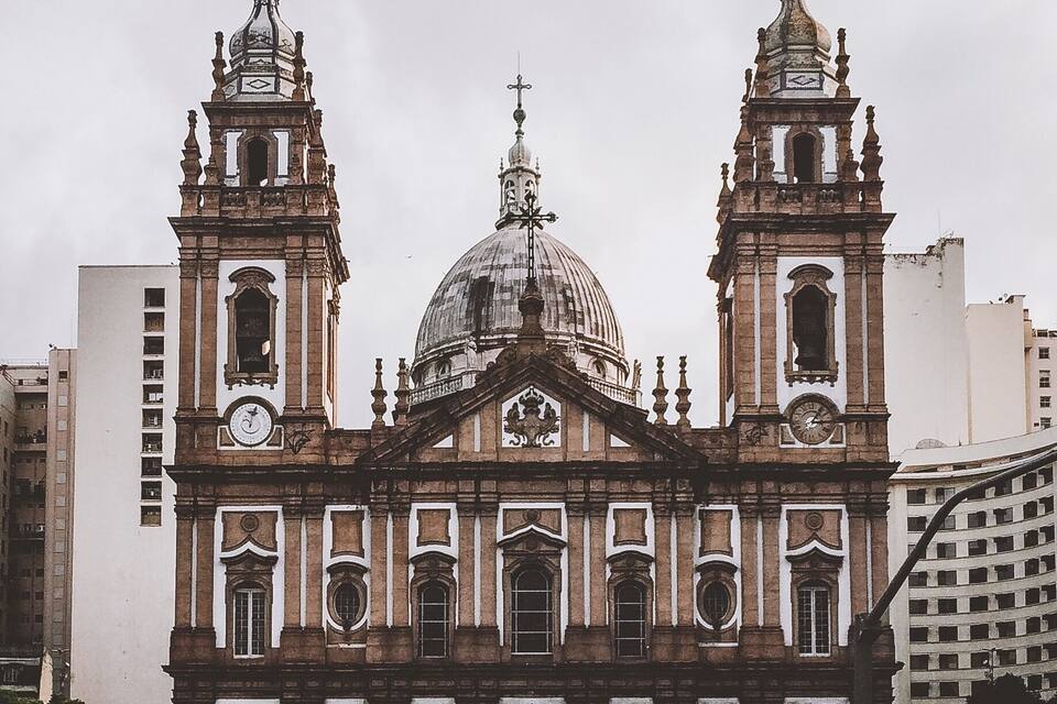 A historic church with two towers and a large dome.