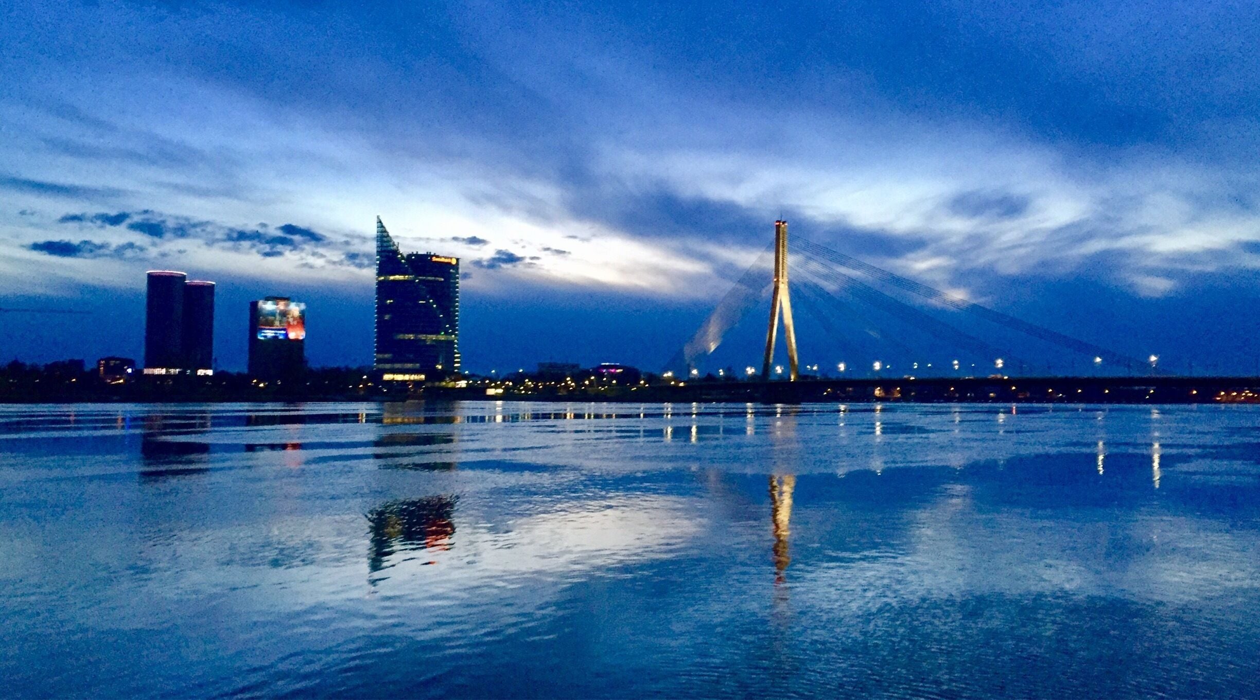 By the river in the evening. Beautiful sky and reflections. 