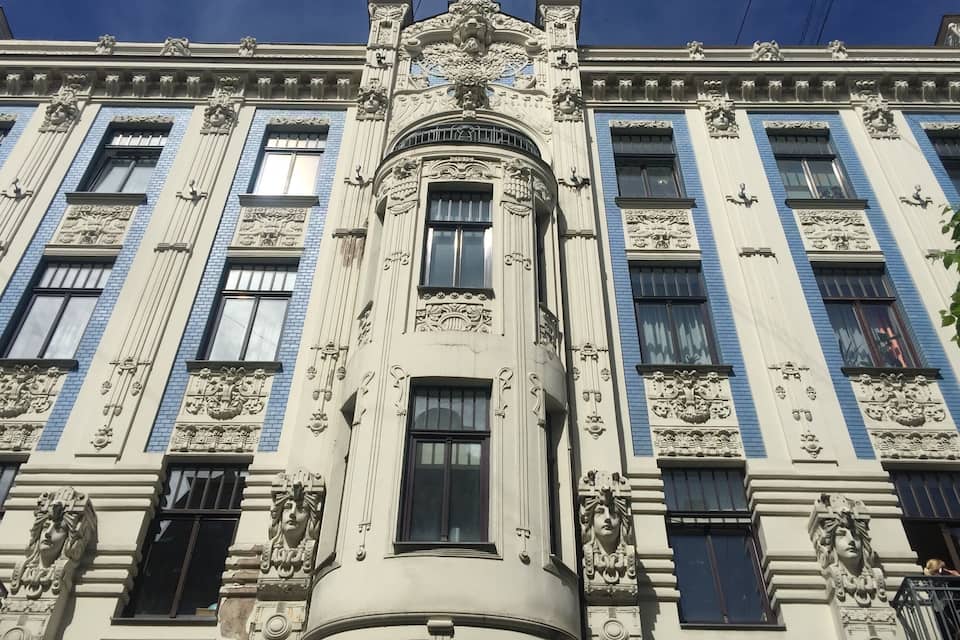 A building with ornate architectural details, including columns and decorative carvings.