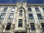 A building with ornate architectural details, including columns and decorative carvings.