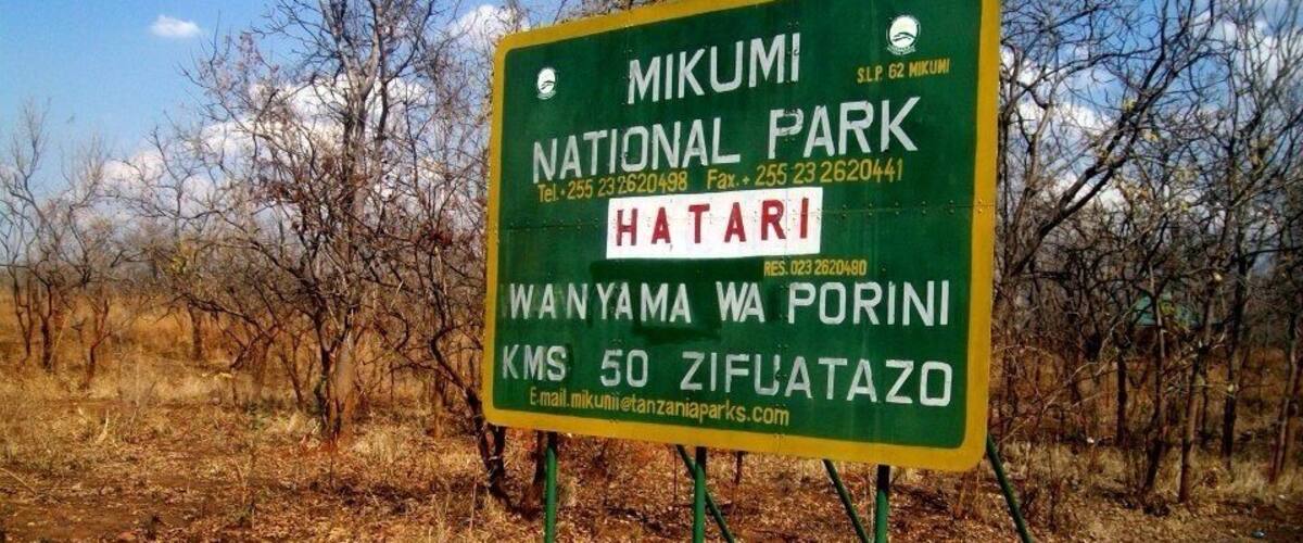 A sign for Mikumi National Park, indicating the Hatari area and the Wanyama Wa Porini campsite.