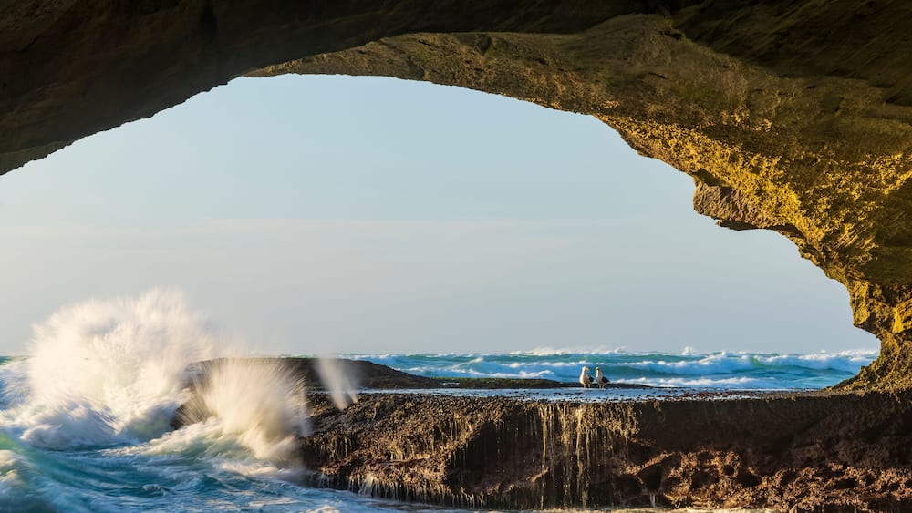 Image Number A1RT48099. An eerie view taken from the back of Waenhuiskrans sea-cave towards the mouth of the cave and the sea. Arniston. Overberg. Western Cape. South Africa