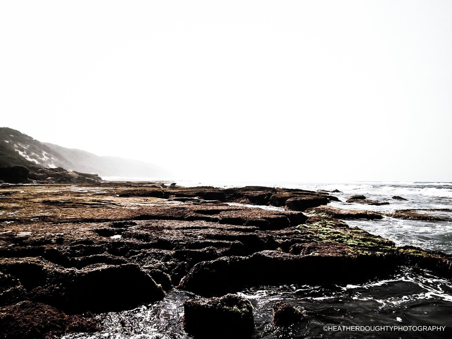 Cape Vidal is located on the coastline of South Africa. The waves crashed against the rocks leaving tide pools for the local Ghost crabs