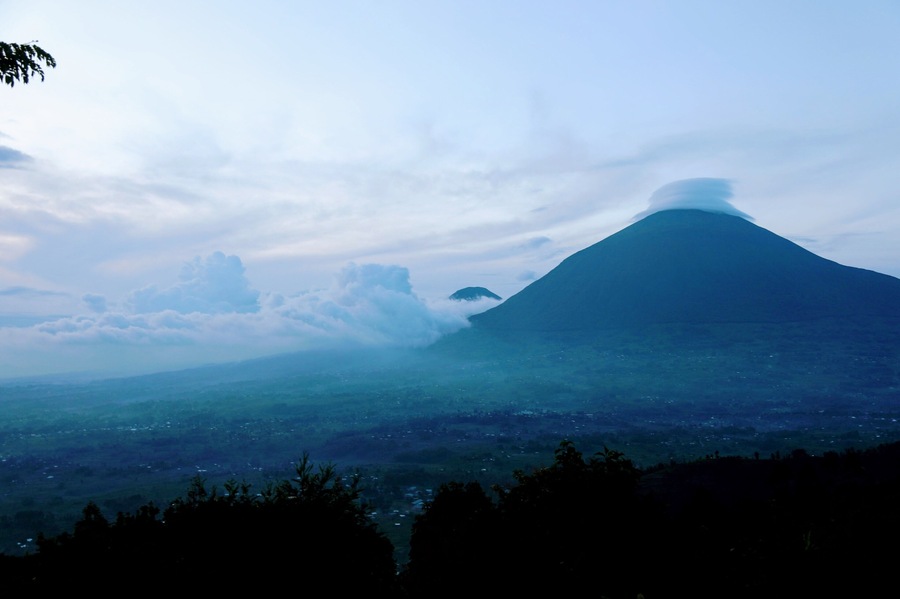 This is near sunset at the beautiful Virunga lodge  Rwanda surprised me with its beauty and here at the lodge beauty just strikes you in a way you never forget. The fact that the memories of the lodge are not completely forgotten when compared to the gorilla treks is a testament to how great it is.  I blog at circlingthebucketlist if you want to see more pictures of my time here or read about my impressions.