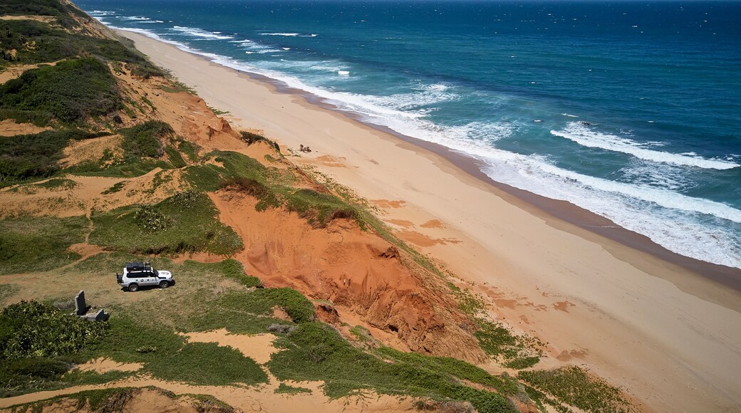 Jeep on dunes in front of the Indic Ocean, Xai-Xai, Mozambique