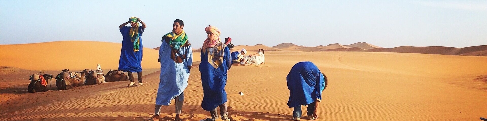 Riding the camels into Sahara desert with our Berber guides