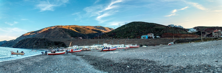 small fishing boats on the beach of Oued Laou, a coastal town in the province of Chefchaouen, Morocco