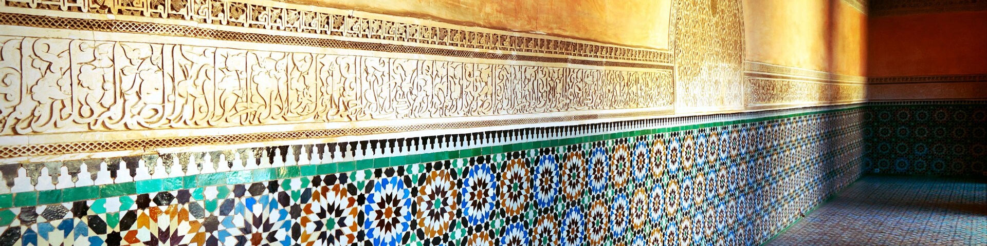 Decorations and shadows of the old Koranic School in Marrakech at sunset