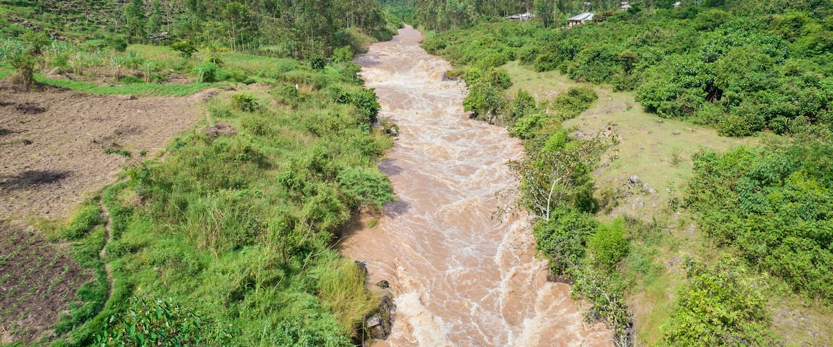 Aerial view of the lush and serene River Yala flowing through the tranquil landscape with greenery and trees, Sinaga, Kenya.