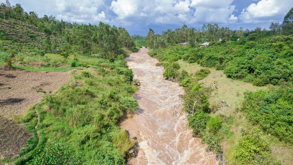 Aerial view of the lush and serene River Yala flowing through the tranquil landscape with greenery and trees, Sinaga, Kenya.