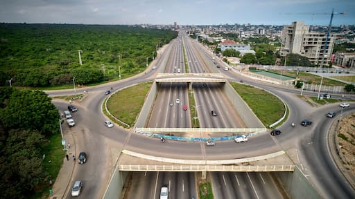 Bird's eye view of the Achimota forest with highway traffic on a roundabout