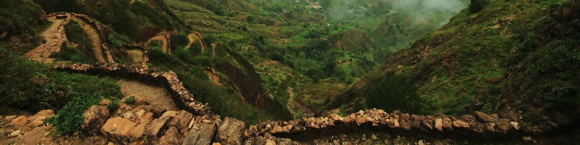 Hiking from the Cova Crater to Cidade Dad Pombas starts off with the most incredible view across the valley. Follow the steep, twisting path down below the clouds for the most beautiful hike on the island of Santo AntĂŁo.