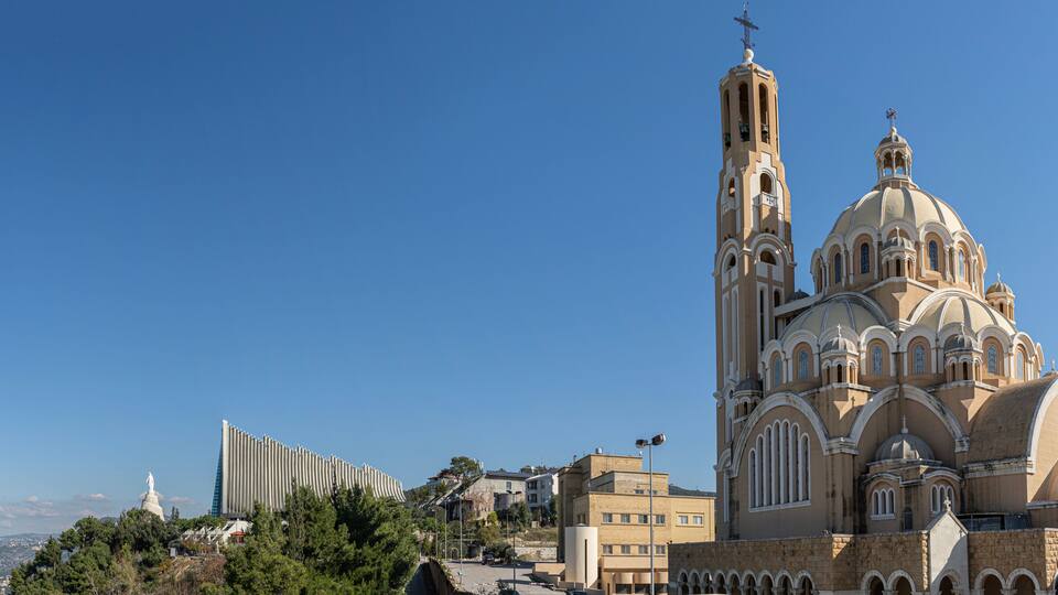 A church with a tall bell tower and a dome.