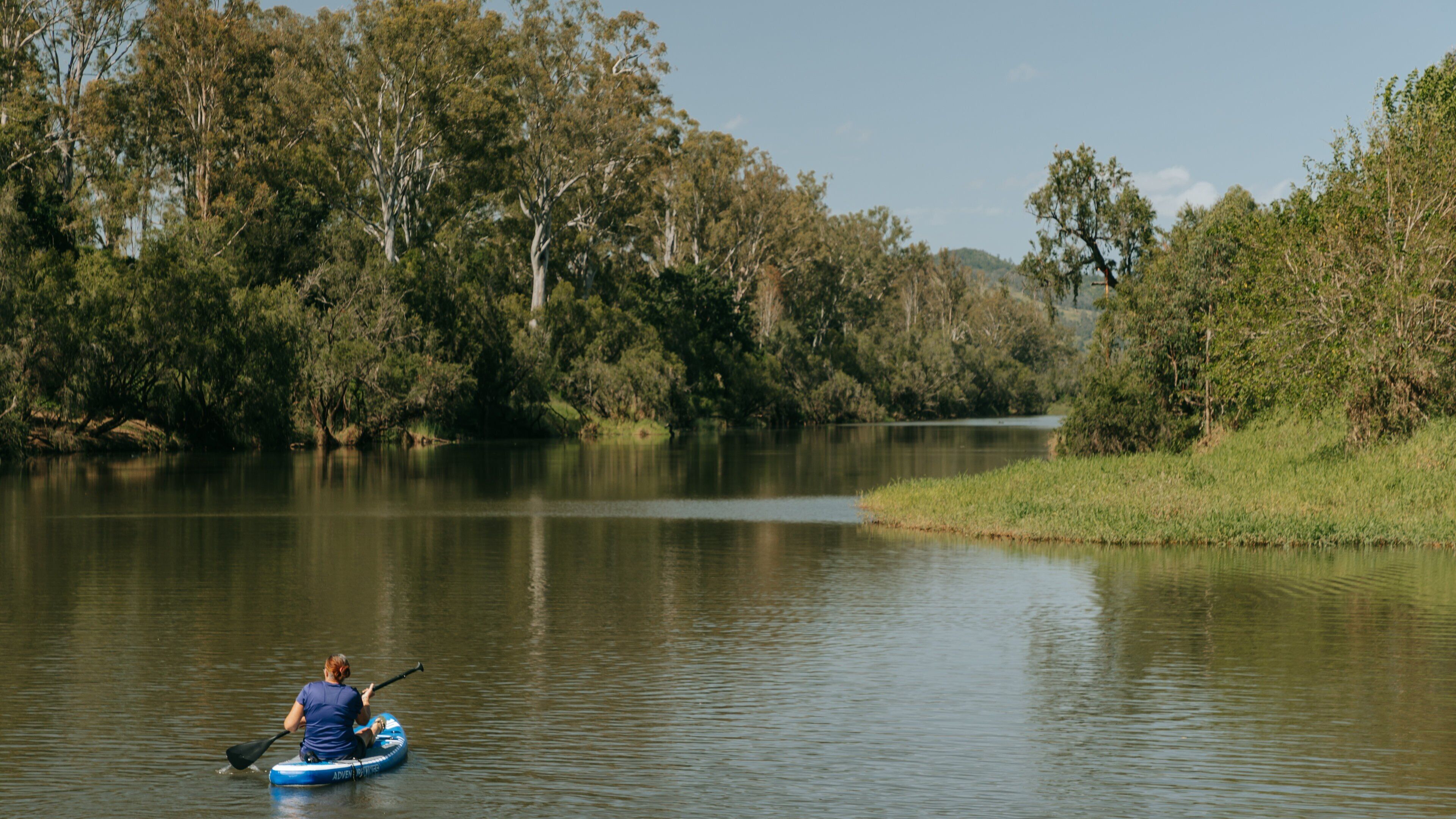 Fernvale showing kayaking or canoeing and a river or creek as well as an individual femail
