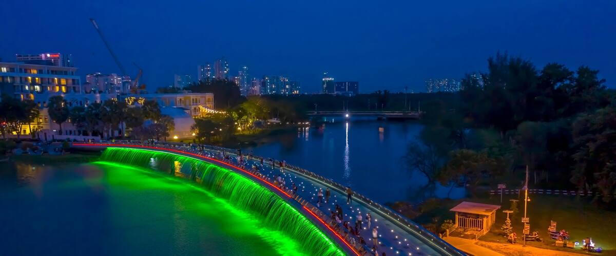Aerial view of Starlight Bridge or Anh Sao Bridge which is a pedestrian bridge with colored lights and waterfall in District 7 of Ho Chi Minh City also known as Saigon, Vietnam.