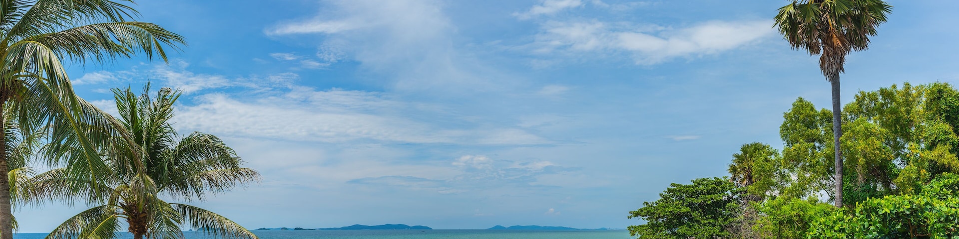 The beach on sunny day .