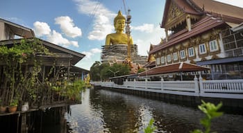 The construction site of the Big golden buddha statue at Wat Paknam temple nearby Phasi charoen canal in Bangkok Thailand