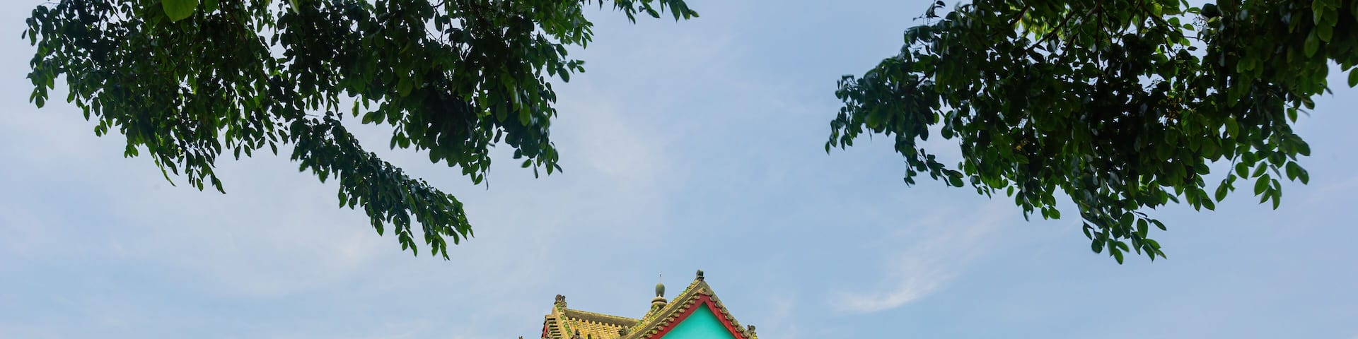 Sunny exterior view of the Juguang Tower