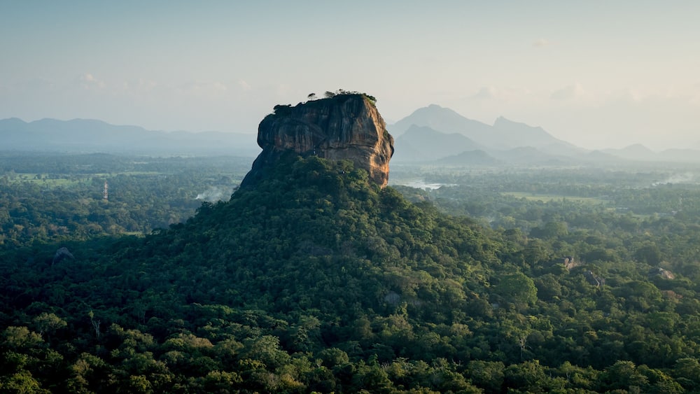 a sunset view of lion rock sigiriya from pidurangala looking across the sri lankan high country