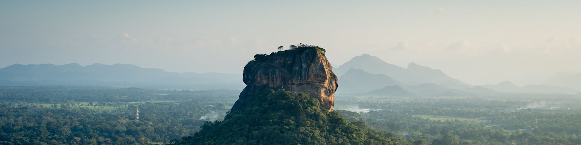 a sunset view of lion rock sigiriya from pidurangala looking across the sri lankan high country