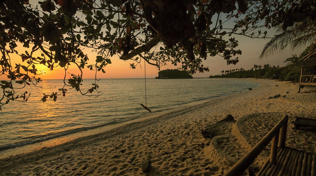 Sipping a beer and watching the sun go down couldn't get any better in Binucot Beach in Ferrol, Romblon, Philippines.