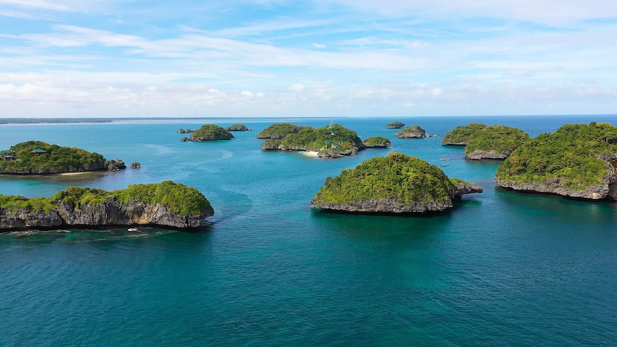 Cluster of small islands in Hundred Islands National Park, Pangasinan, Philippines. Aerial drone: Famous tourist attraction, Alaminos. Summer and travel vacation concept