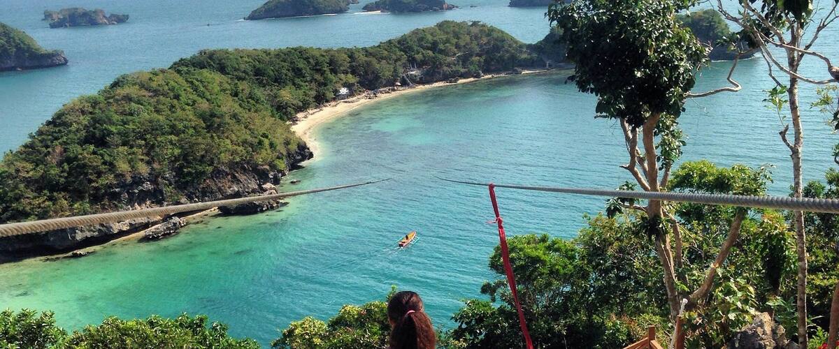 In northern Luzon in the #Philippines there is a place called Hundred Islands #NationalPark. Tons of little islands, blue water and life. Here is the view from the Governors Island Viewing Deck, and the zip line to the next island. It's more fun in the Philippines