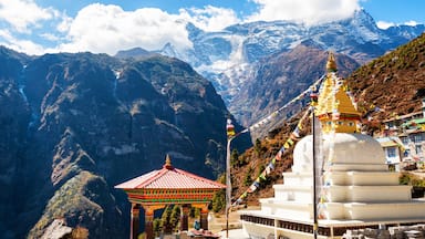 A mountain landscape with a temple and prayer flags.