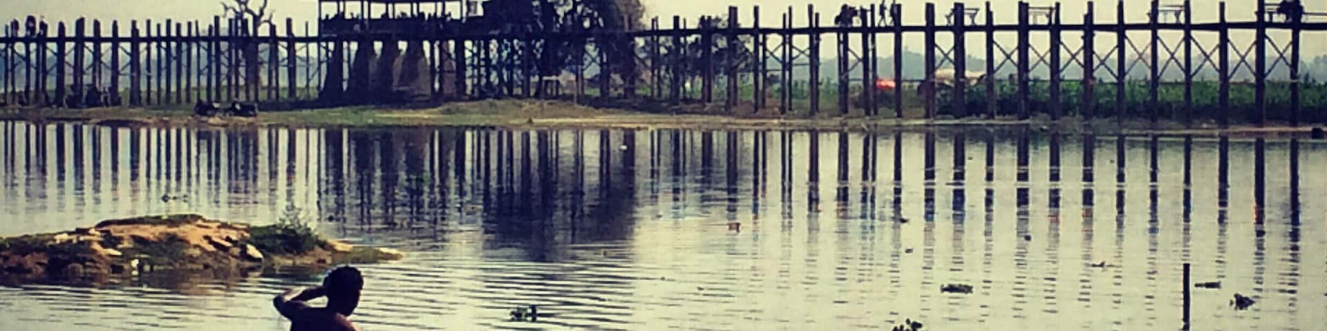U Bein Bridge is a crossing that spans the Taungthaman Lake near Amarapura in Myanmar. The 1.2-kilometre bridge was built around 1850 and is believed to be the oldest and longest teakwood bridge in the world.