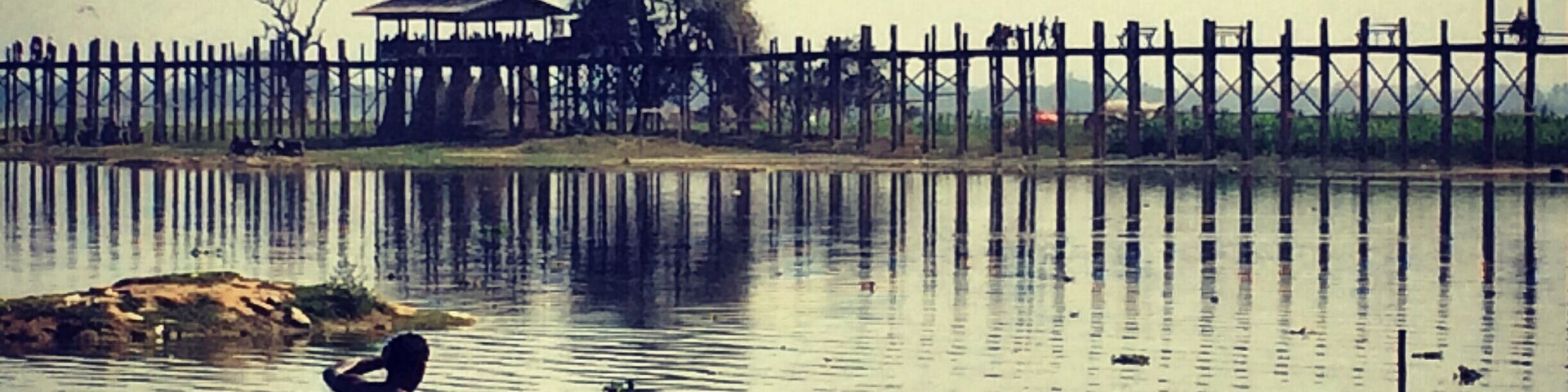 U Bein Bridge is a crossing that spans the Taungthaman Lake near Amarapura in Myanmar. The 1.2-kilometre bridge was built around 1850 and is believed to be the oldest and longest teakwood bridge in the world.
