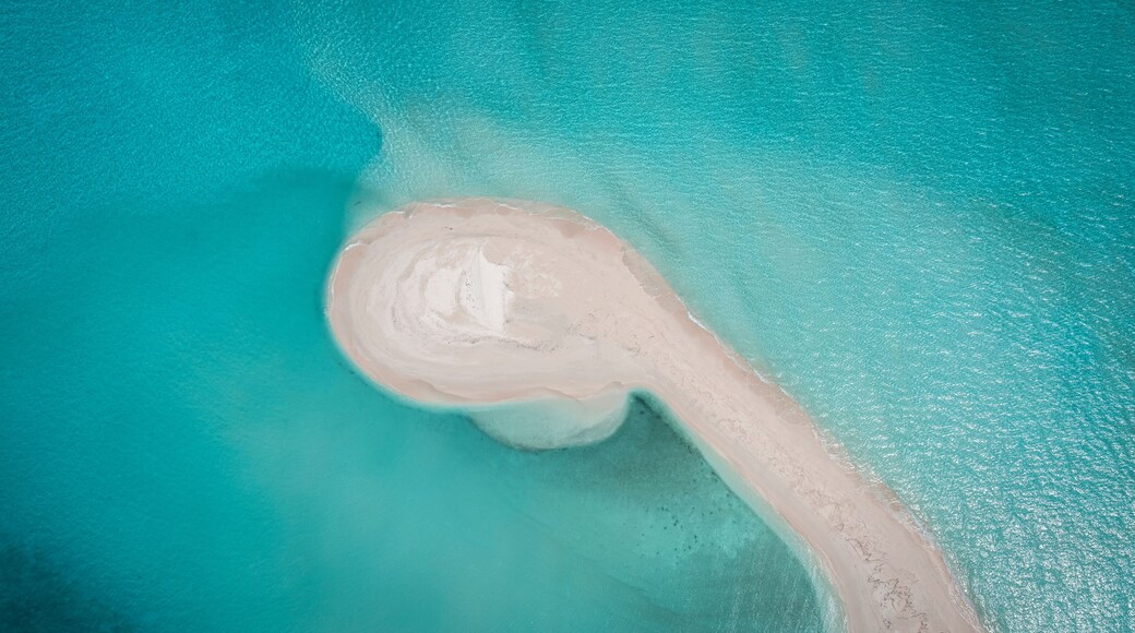 Aerial drone view of a sandbank in a blue lagoon, Vashafaru, Haa Alif Atoll, Maldives.