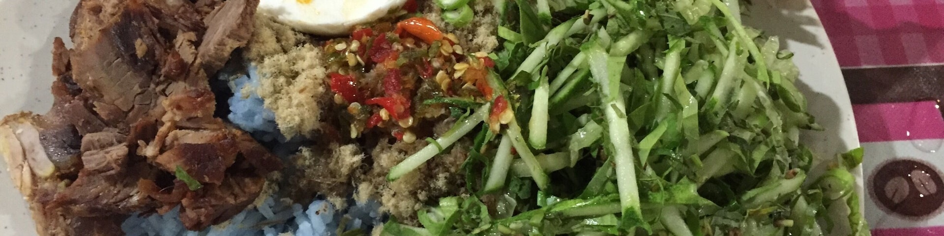 If you are a tourist or just feeling like wanting to try something unique go for this salad rice (Nasi Kerabu). Mix all the ingredients well preferably with hands. Eating with your hand is the norm here. Steal a glance and see how the locals did it.