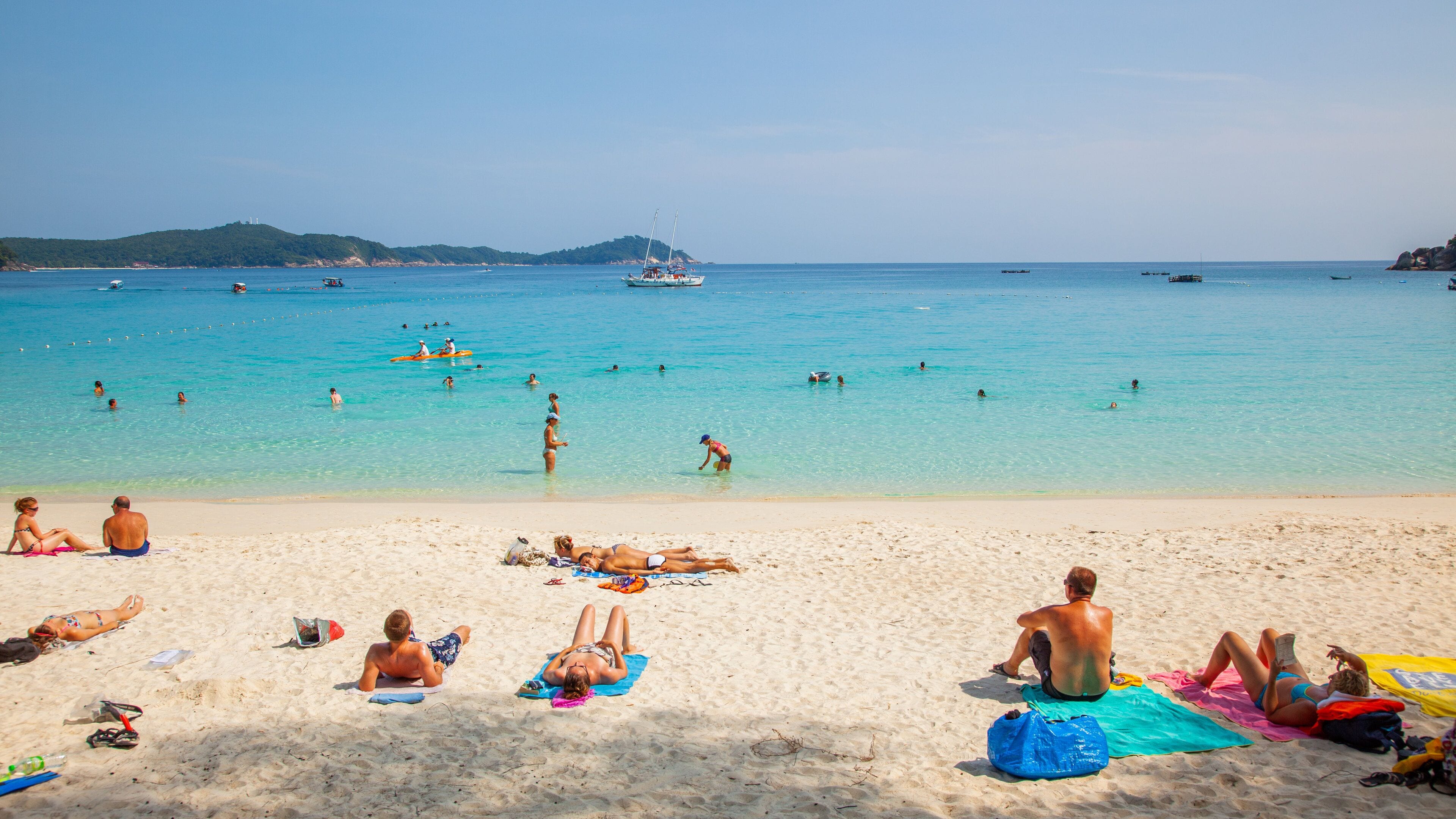 Perhentian Island which includes swimming, general coastal views and a beach
