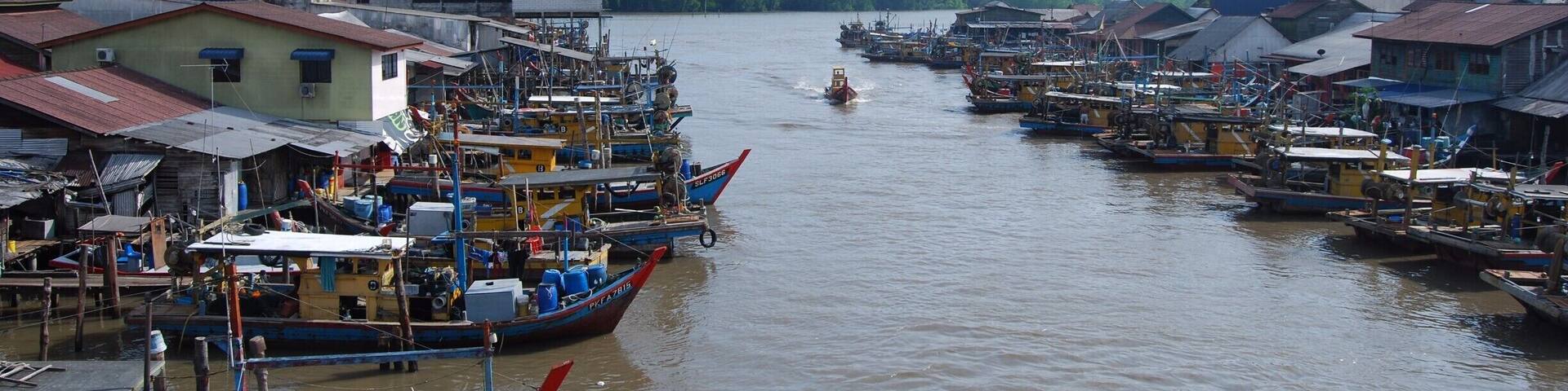 This sleepy fishing village is a really cool place to see. Near the tiny market in the middle of the village is a concrete walking/scooter bridge that crosses the river. This is where I took this photo and is the best place to see the heart of the village.