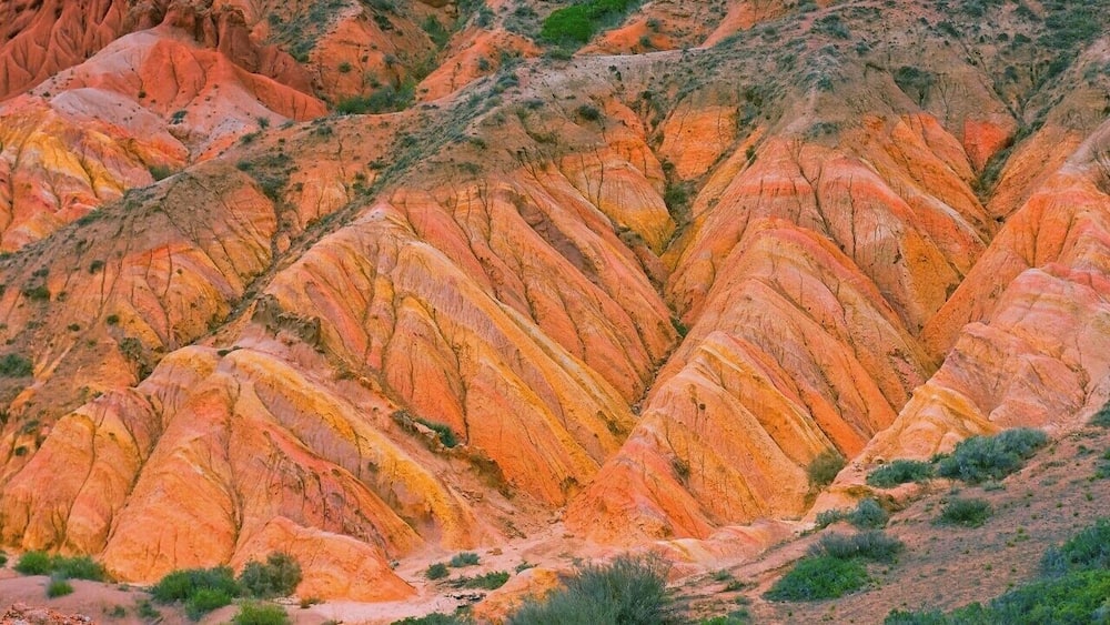 August 2013
Fairy tale canyon, Issyk-kul lake
Skazka (=Fairy tale) canyon on the south shore of Issyk-kul lake. It is located few kilometres from Tosor village and contains yellow, orange or red sandstone formations of various shapes resembling fairy tale dragons, giants or castles. This particular erosion formation is similar to Rainbow hills in Iceland.