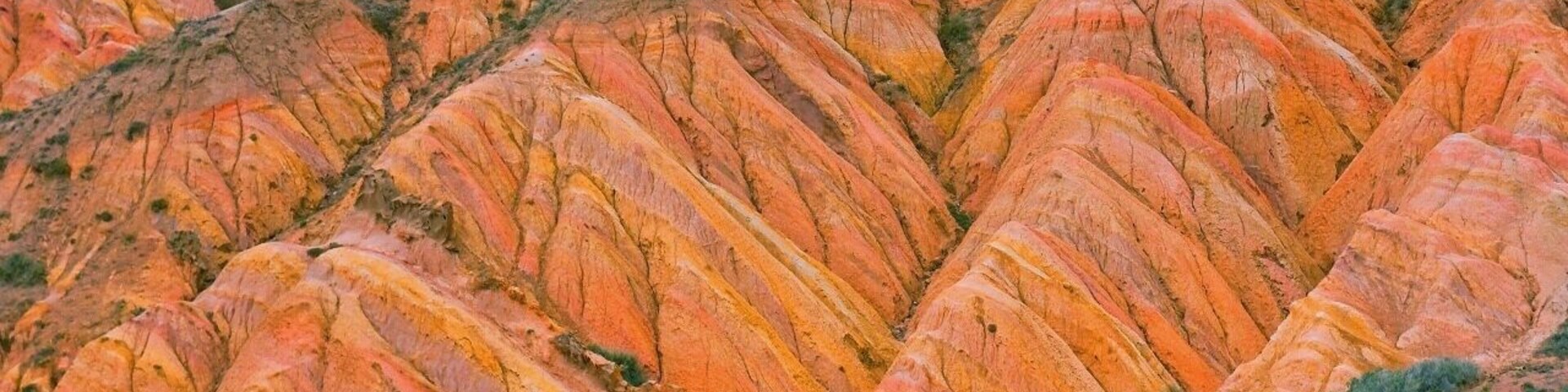 August 2013
Fairy tale canyon, Issyk-kul lake
Skazka (=Fairy tale) canyon on the south shore of Issyk-kul lake. It is located few kilometres from Tosor village and contains yellow, orange or red sandstone formations of various shapes resembling fairy tale dragons, giants or castles. This particular erosion formation is similar to Rainbow hills in Iceland.