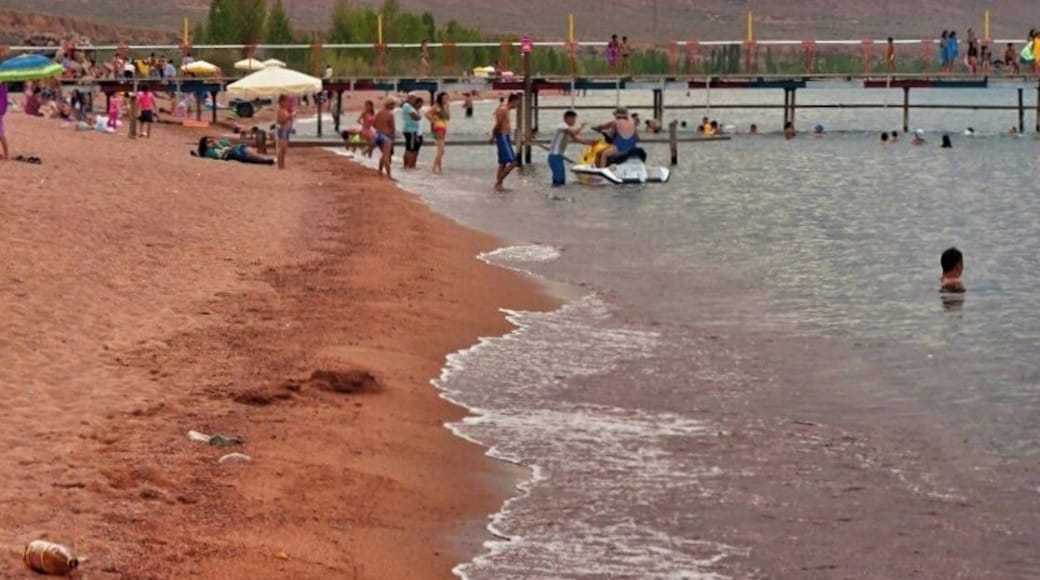 August 2013
Kaji Say, Issyk-kul Lake, Kyrgyzstan
Issyk Kul is an endorheic (i.e. inflow only) lake in eastern Kyrgyzstan. It is the tenth largest lake in the world by volume (though not in surface area), and the second largest saline lake after the Caspian Sea and the second largest mountain lake after Titicaca. Although it is surrounded by snowy peaks, it never freezes hence its name, which means "hot lake" in the Kyrgyz language. It is some 180 km long and 60 km wide, up to 600 meters deep and located in altitude ca. 1.600 meters, very popular for recreation, mainly in resorts on its north shore. Kaji Say is on south shore and more calm and relaxed place. The mountains in picture are Terskey Alatau range of Northern Tian Shan. The lake has some 20 percent salinity compared to oceans. However an ocean for Kyrgyz for sure.