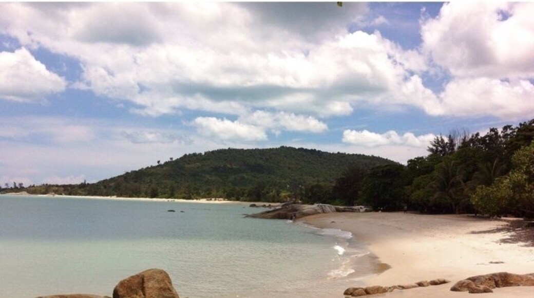 Tanjung Pesona beach on a sunny day. You can walk to the middle of the sea.