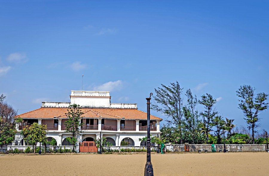 Ancient bungalow with vintage lamp post near Danish fort in Tranquebar, Tamil Nadu, India