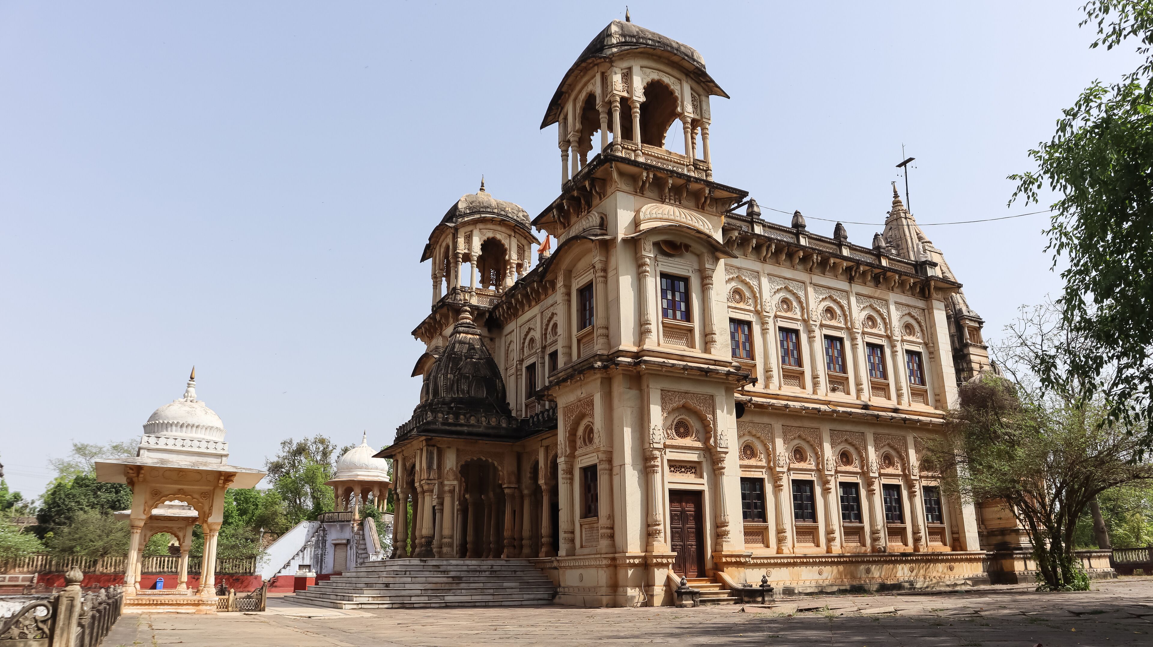 A historic building with ornate architecture, including domes and intricate carvings.